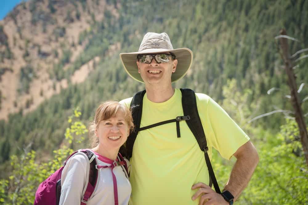 John and wife standing together outside