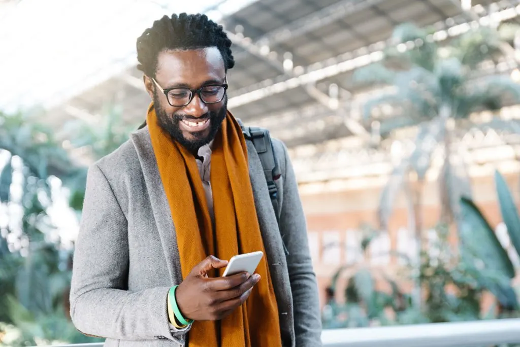 man using a smartphone outside