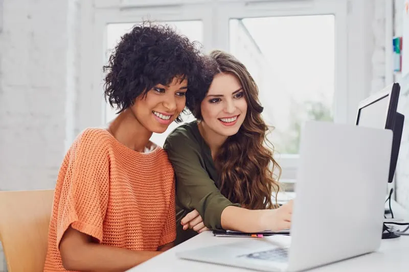 Two women blogging together.